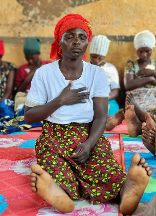 Caregivers practicing mindfullness techniques in the group